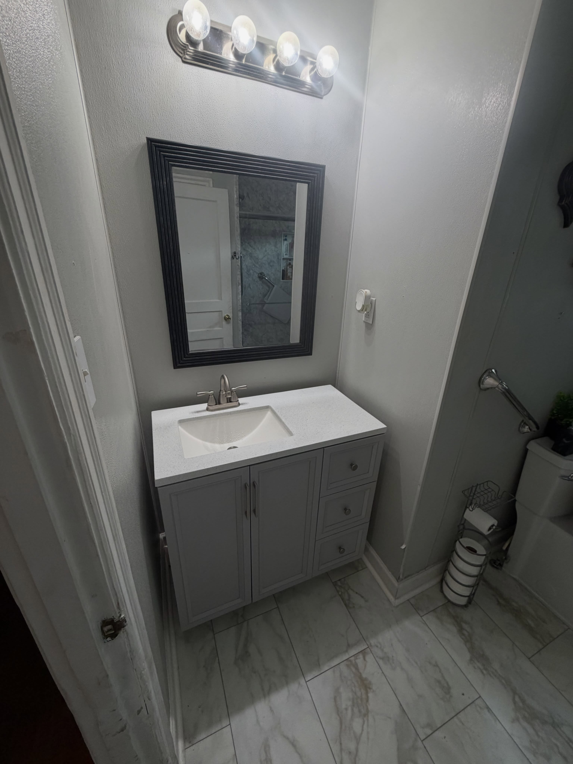 Completed floating vanity installation by Miller's Construction