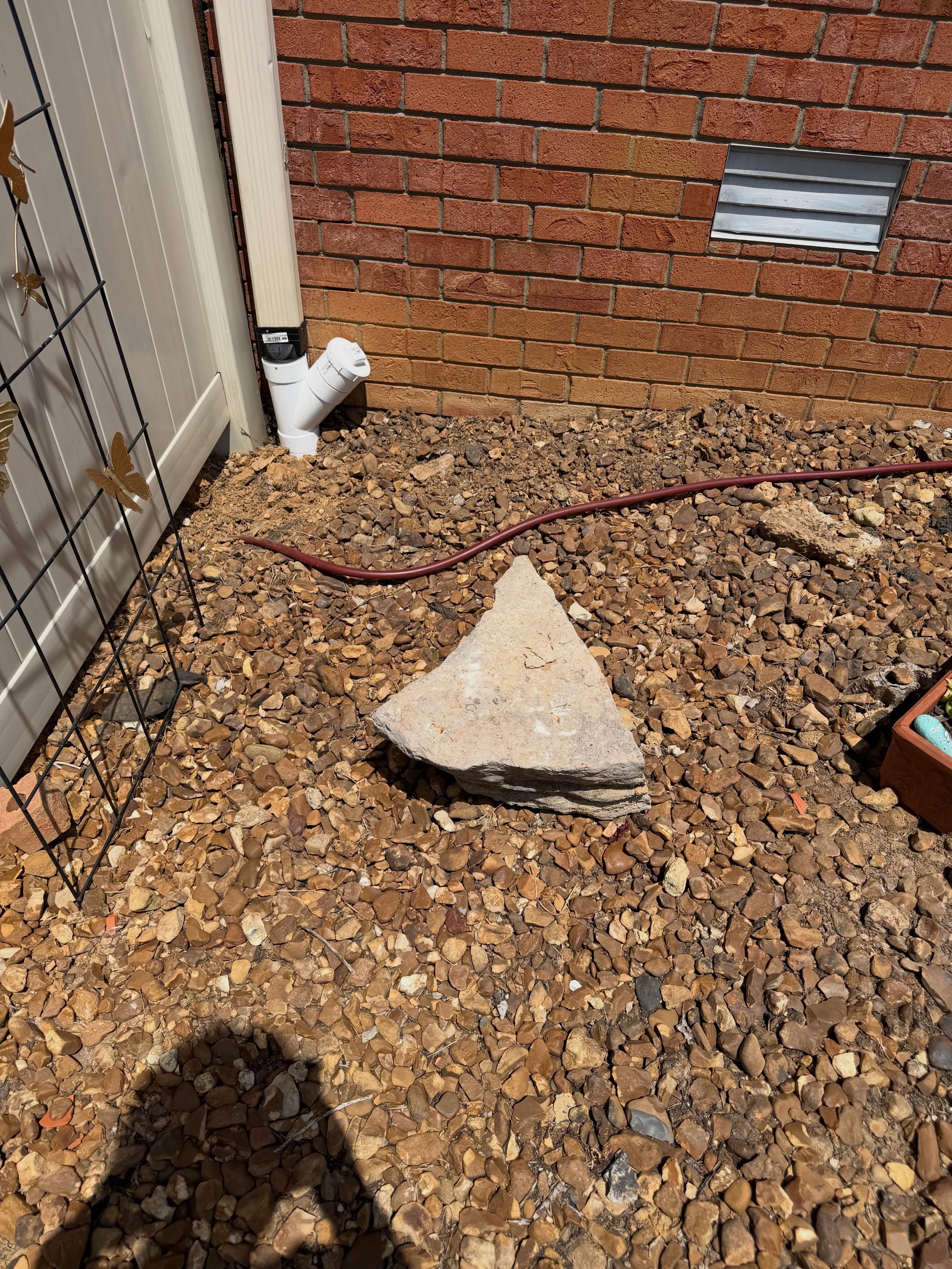 PVC underground downspout drainage installation by Miller's Construction